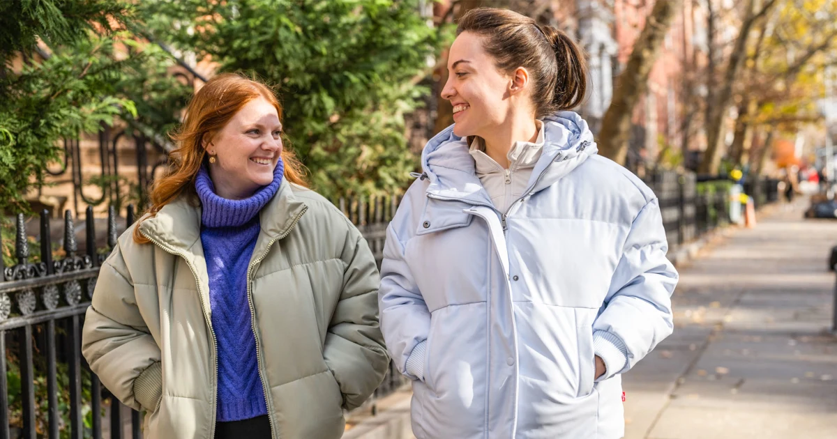 2 girls wearing winter jackets
