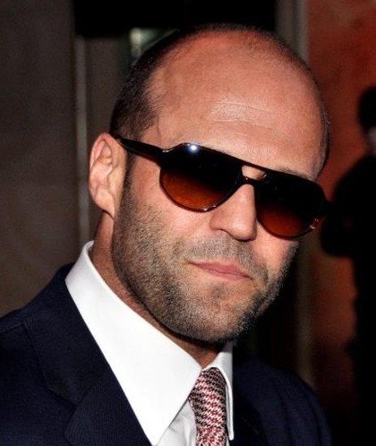 Jason Statham in a suit and sunglasses in 2012
